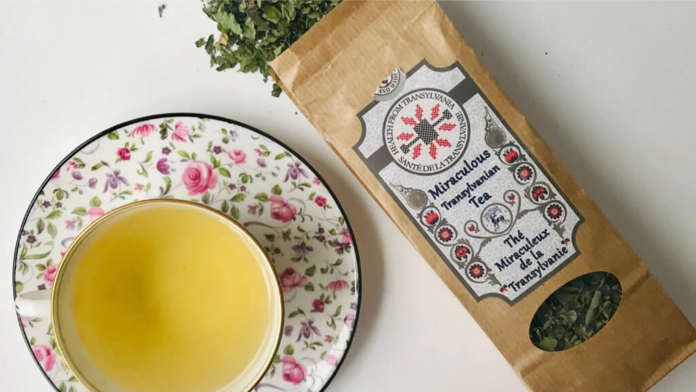 Organic Miraculous Tea pack and tea cup with herbal tea