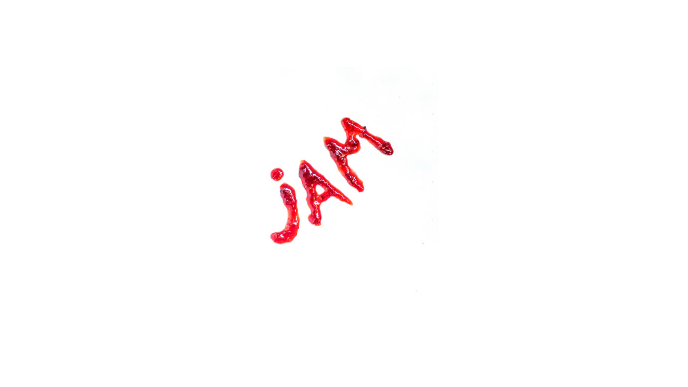Jam letters written with raspberry fruit jam