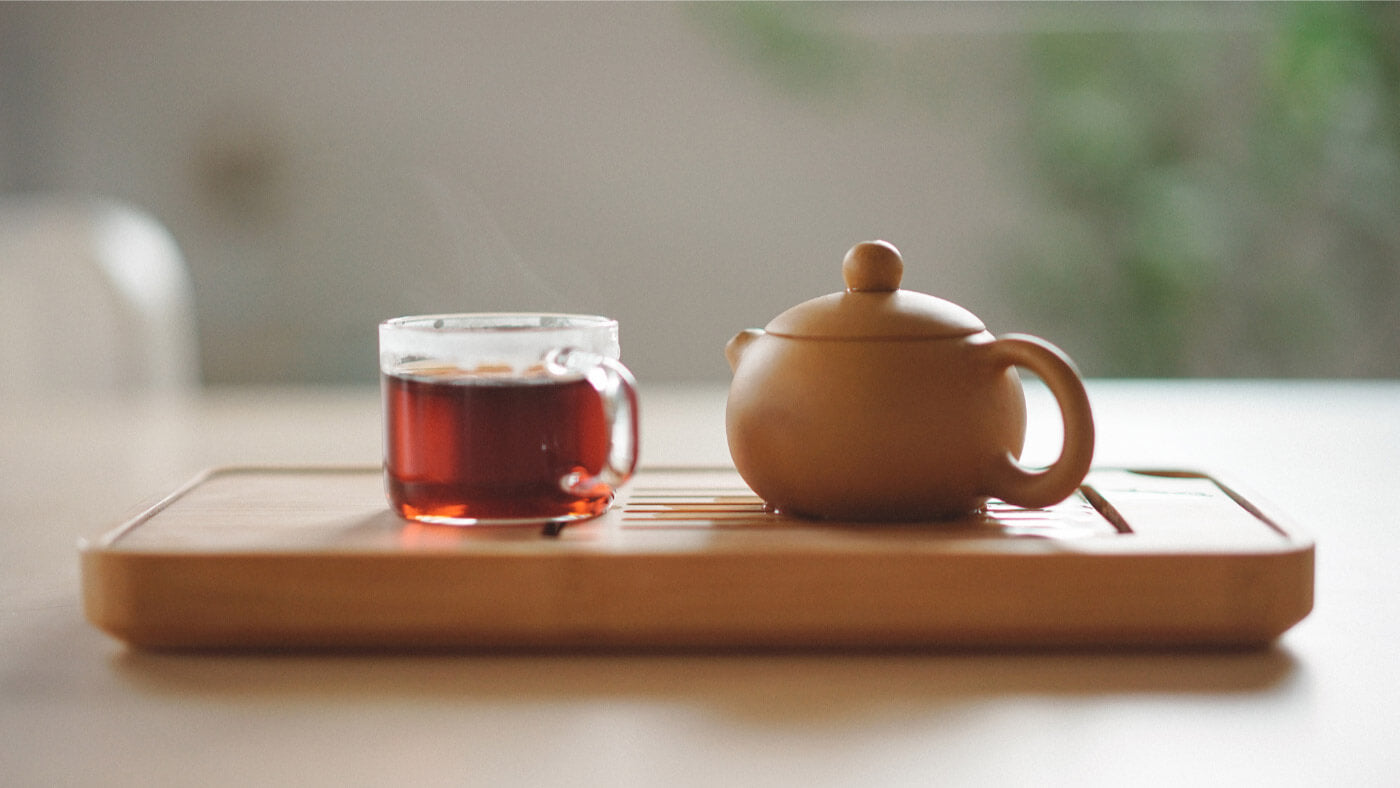 Glass tea cup and tea pot