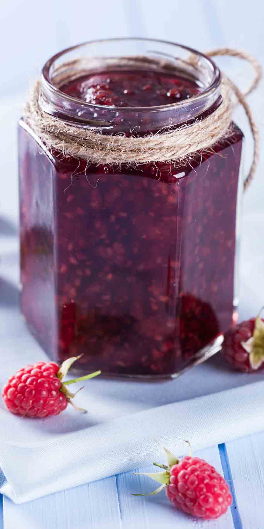 Open jar of artisan raspberry jam